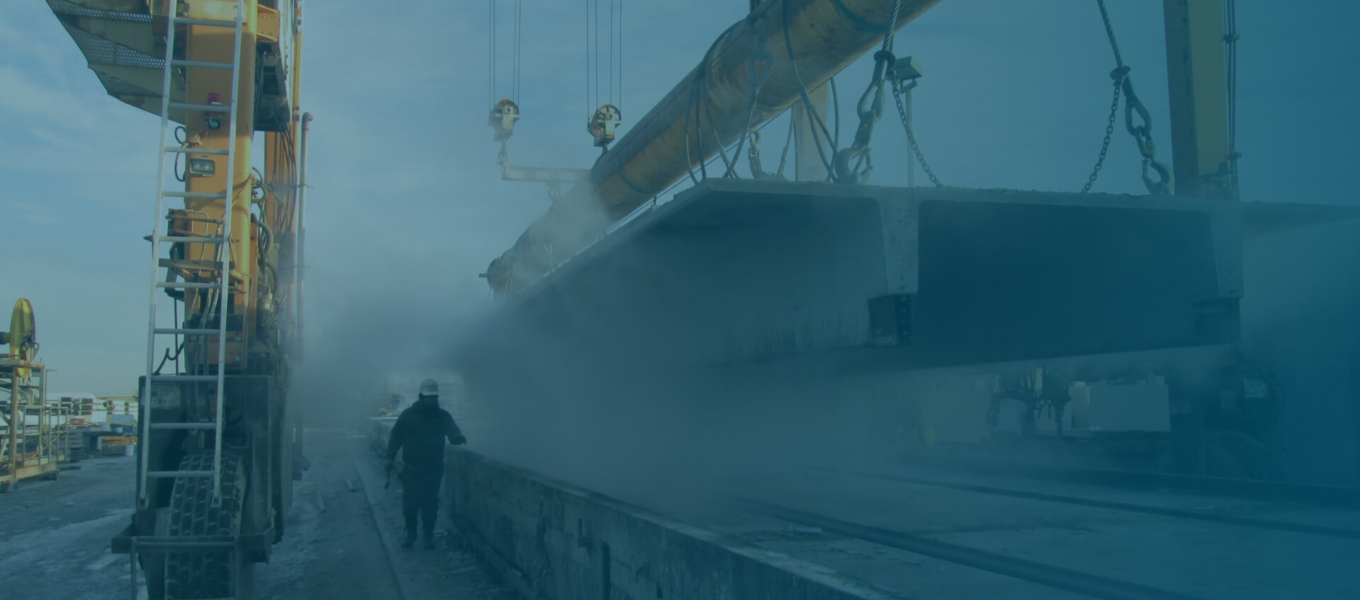 large concrete clab being moved by heavy machinery