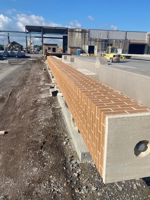 Precast concrete column with brick front being stored at Nitterhouse Concrete's warehouse.